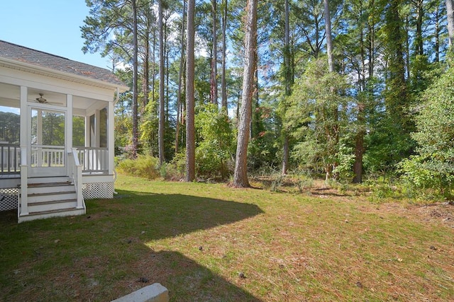 view of yard featuring a sunroom