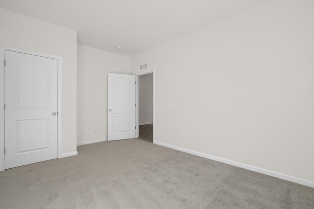 unfurnished bedroom with light carpet