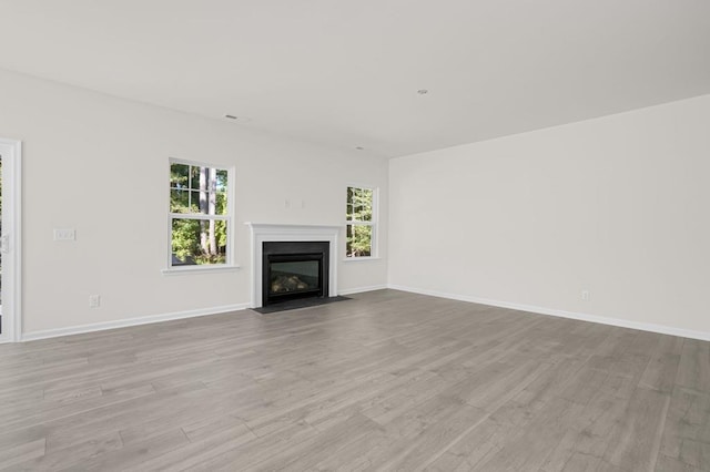 unfurnished living room with light wood-type flooring