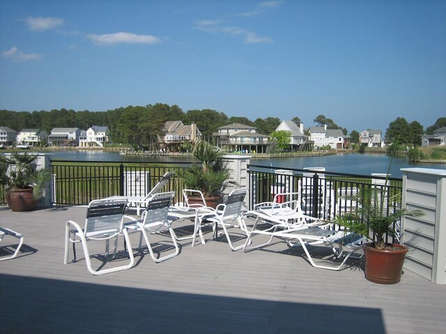 wooden deck featuring a water view