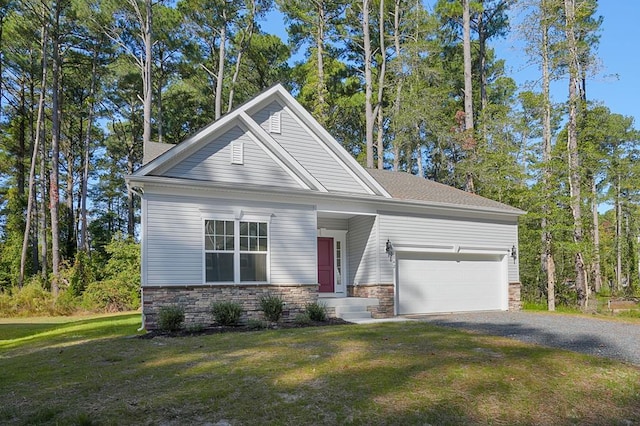 view of front of property with a front yard and a garage