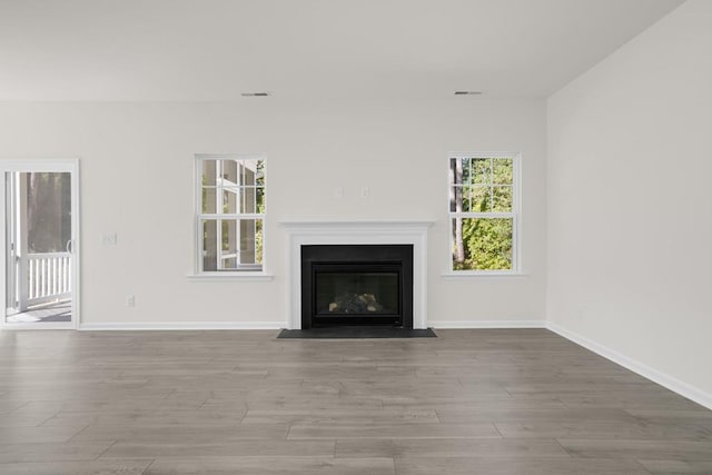 unfurnished living room featuring light wood-type flooring