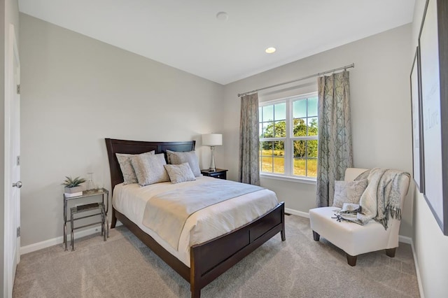 bedroom featuring light carpet