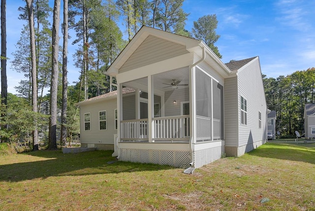 view of front of property featuring a sunroom and a front yard