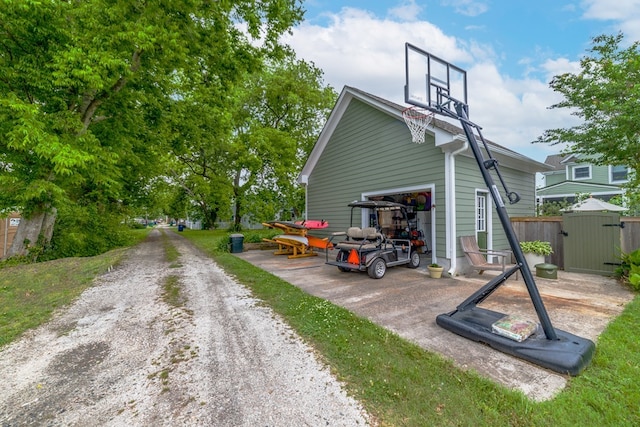 exterior space with a garage and an outdoor structure