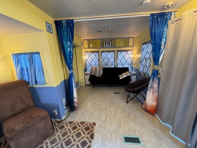 sitting room featuring hardwood / wood-style floors