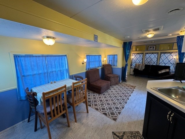 dining room featuring sink