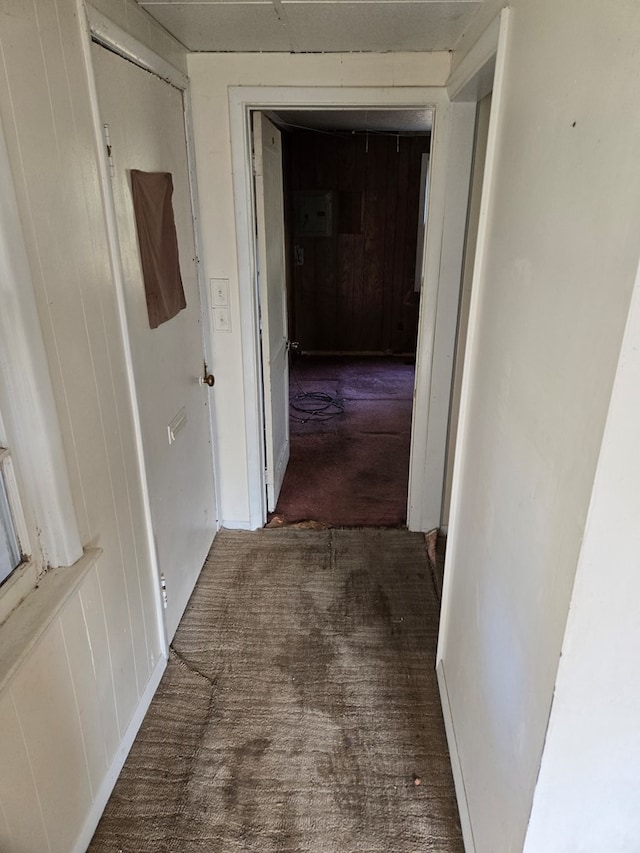 corridor with dark carpet