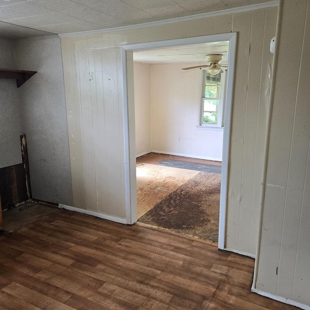 27409 Blueberry Dr, Cape Charles, VA 23310 - spare room featuring wood finished floors, ornamental molding, wood walls, and a ceiling fan