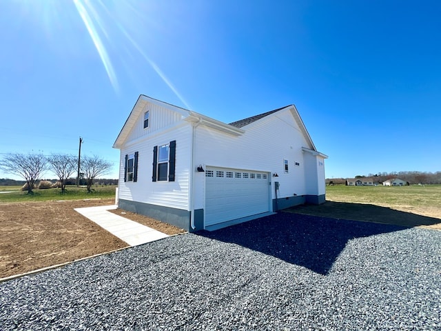 37734 Blue Crab Cir, Painter, VA 23420 - view of home's exterior with gravel driveway, crawl space, and an attached garage