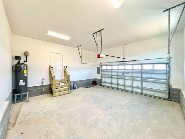 37734 Blue Crab Cir, Painter, VA 23420 - garage featuring electric water heater and a garage door opener
