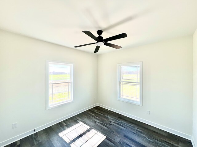 37734 Blue Crab Cir, Painter, VA 23420 - empty room featuring dark wood finished floors, baseboards, and ceiling fan