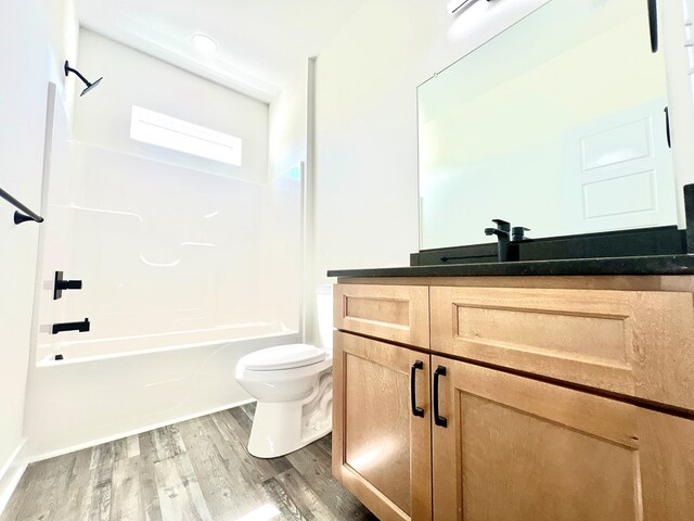 37734 Blue Crab Cir, Painter, VA 23420 - bathroom with toilet, shower / bath combination, vanity, and wood finished floors