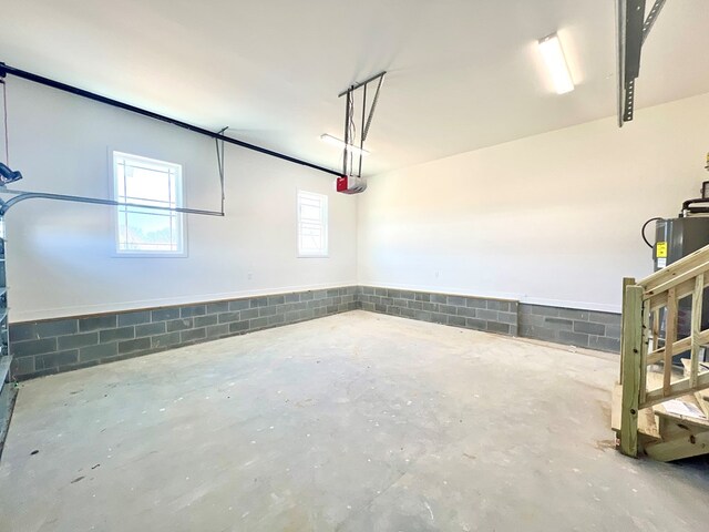 37734 Blue Crab Cir, Painter, VA 23420 - garage featuring a garage door opener and concrete block wall