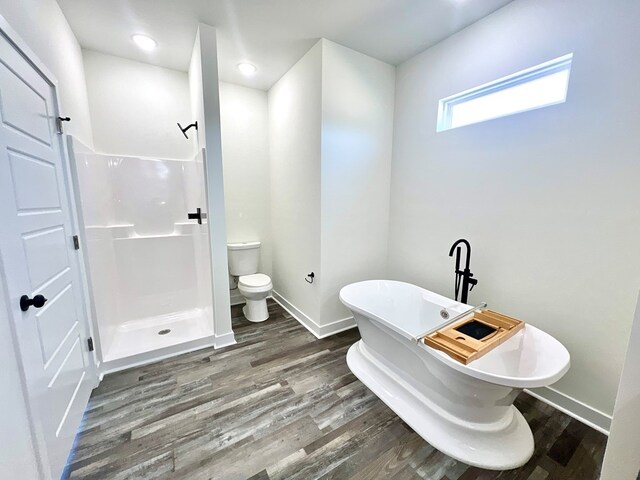 37734 Blue Crab Cir, Painter, VA 23420 - full bath with baseboards, wood finished floors, a stall shower, and toilet