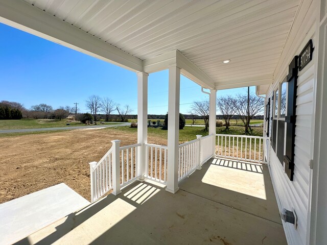 37734 Blue Crab Cir, Painter, VA 23420 - view of patio featuring driveway and covered porch