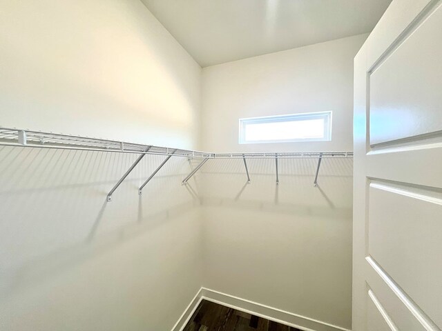 37734 Blue Crab Cir, Painter, VA 23420 - walk in closet featuring dark wood-style flooring
