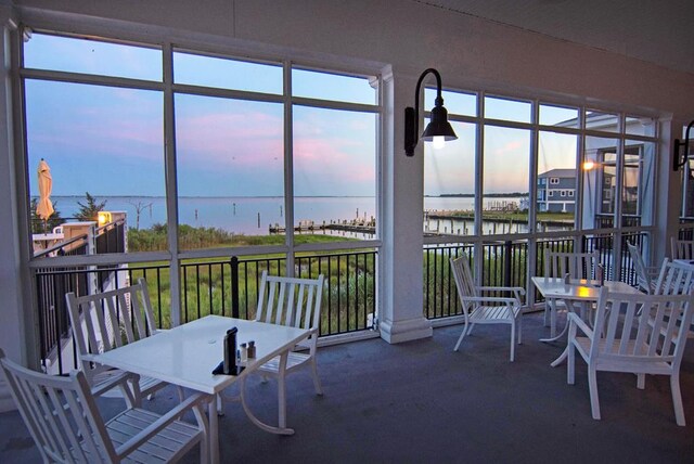 sunroom with a water view