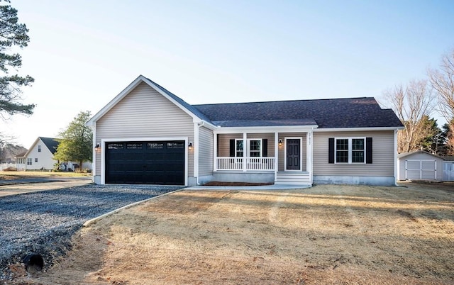 ranch-style house with gravel driveway, covered porch, an attached garage, and a shed