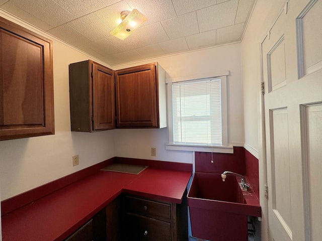 kitchen featuring sink and built in desk