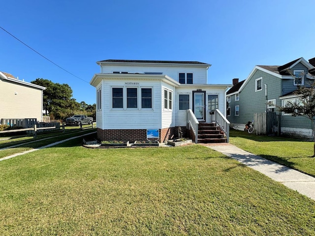 view of front facade with a front yard