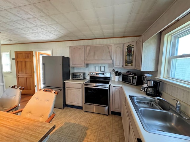 3196 Main St, Chincoteague, VA 23336 - kitchen with a sink, stainless steel appliances, light floors, light countertops, and custom exhaust hood