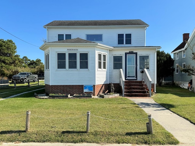 view of front facade with a front lawn