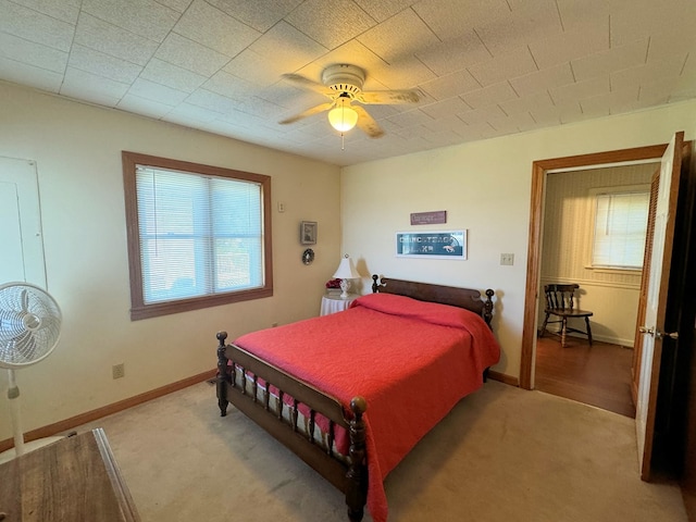 bedroom featuring ceiling fan and carpet flooring