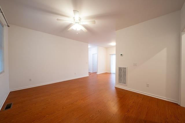 spare room featuring hardwood / wood-style floors and ceiling fan