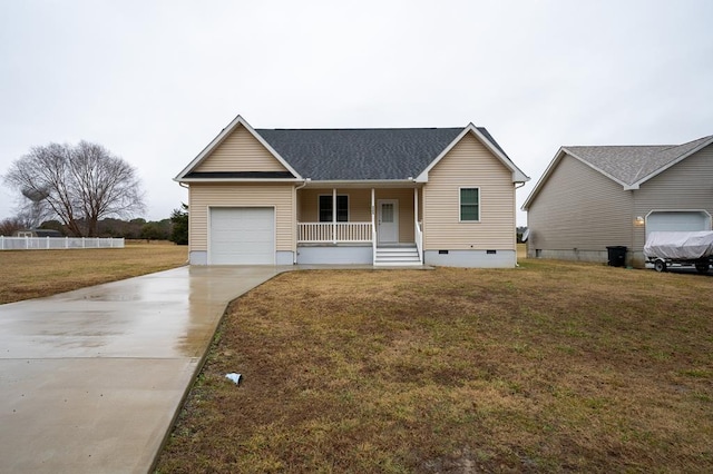 ranch-style house featuring a garage, a front lawn, and a porch