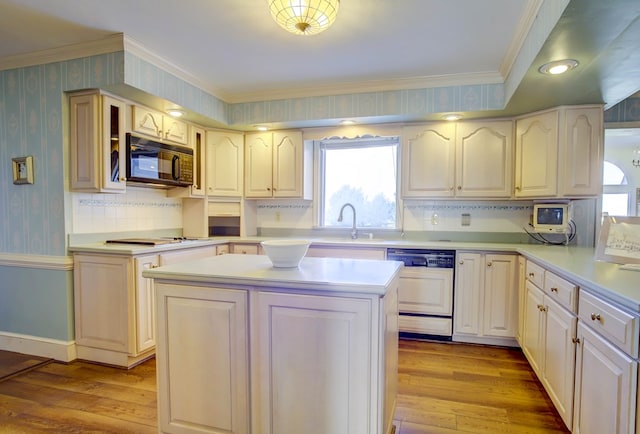 kitchen featuring dishwasher, light wood-type flooring, crown molding, and sink