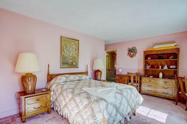 bedroom featuring light carpet