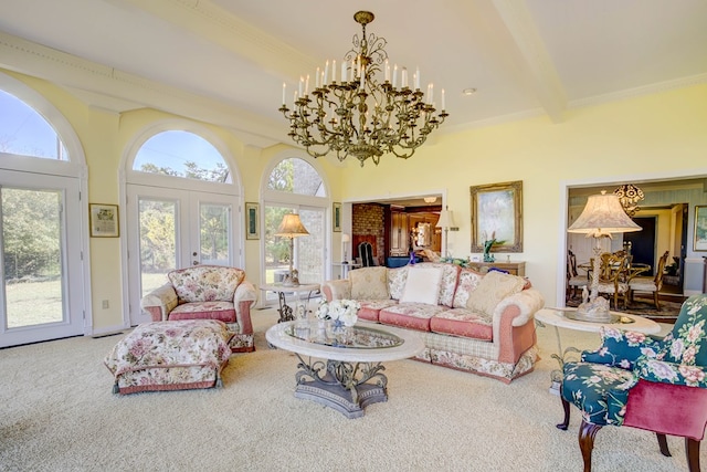 carpeted living room with beam ceiling, an inviting chandelier, ornamental molding, and french doors