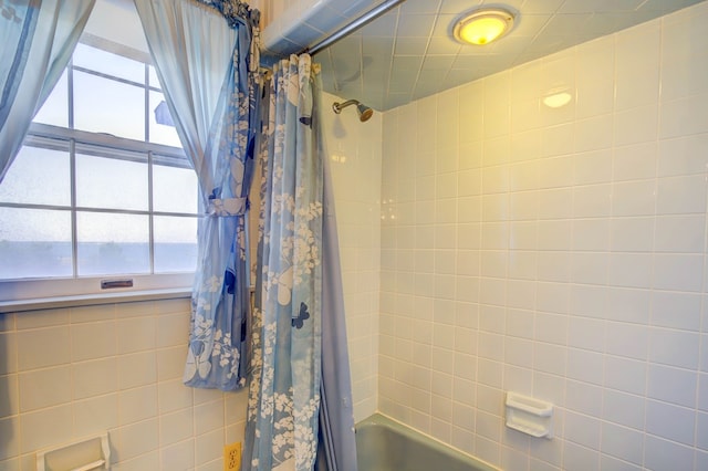 bathroom featuring shower / bath combo with shower curtain