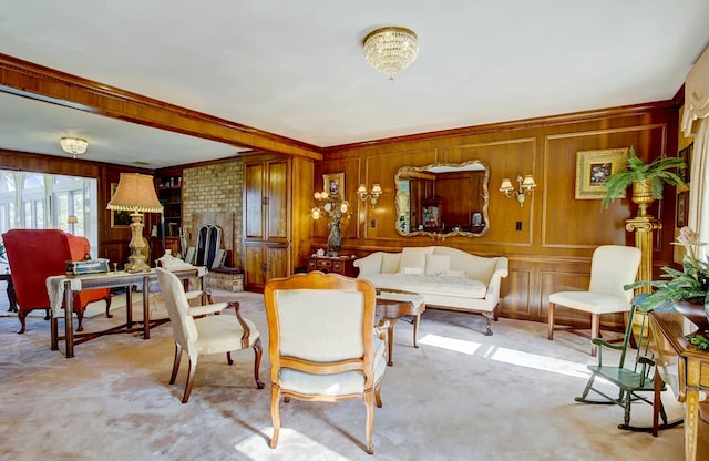 living room with crown molding, light colored carpet, and an inviting chandelier