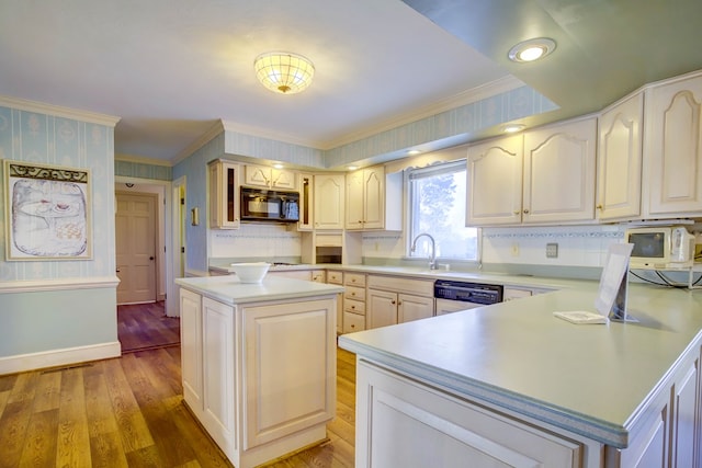 kitchen with dishwasher, a kitchen island, ornamental molding, and sink