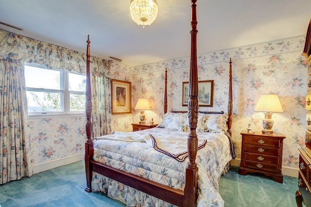 bedroom featuring dark carpet and an inviting chandelier