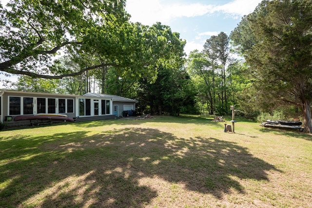 31510 Sunset Dr, Painter, VA 23420 - view of yard with a sunroom and a garage