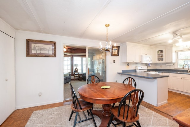 31510 Sunset Dr, Painter, VA 23420 - dining space featuring an inviting chandelier