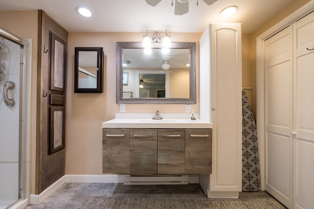 31510 Sunset Dr, Painter, VA 23420 - full bathroom featuring baseboards, a shower stall, and a ceiling fan