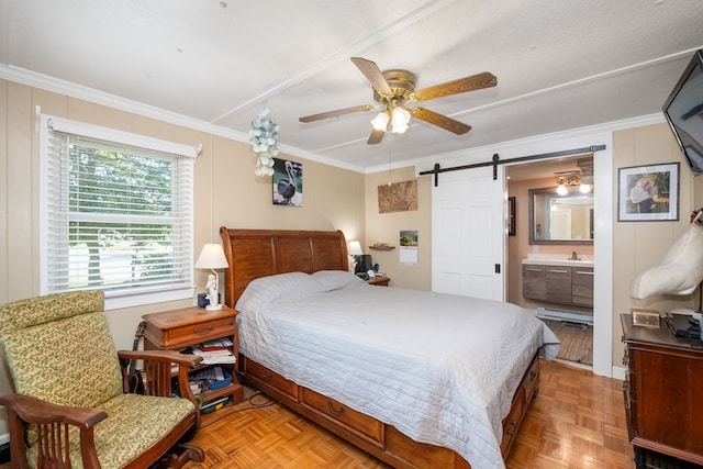 31510 Sunset Dr, Painter, VA 23420 - bedroom with ensuite bathroom, a barn door, a ceiling fan, and ornamental molding