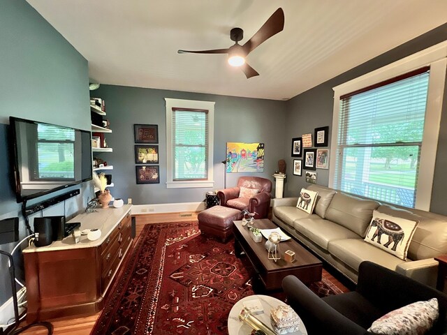 2453 Sand Hill Dr, Cape Charles, VA 23310 - living room with wood finished floors, a ceiling fan, and baseboards