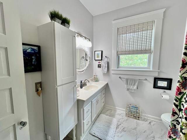 2453 Sand Hill Dr, Cape Charles, VA 23310 - full bath with vanity, marble finish floors, baseboards, and toilet