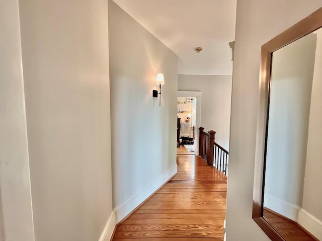 2453 Sand Hill Dr, Cape Charles, VA 23310 - hall featuring an upstairs landing, light wood-style floors, and baseboards