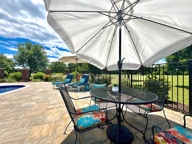 2453 Sand Hill Dr, Cape Charles, VA 23310 - fenced backyard with outdoor dining space and a patio