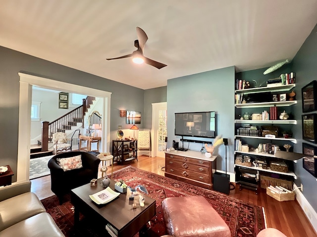 2453 Sand Hill Dr, Cape Charles, VA 23310 - living area featuring stairs, a ceiling fan, and wood finished floors