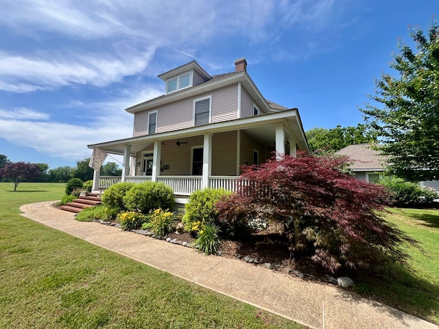 2453 Sand Hill Dr, Cape Charles, VA 23310 - view of front of property with a chimney, a front lawn, and covered porch