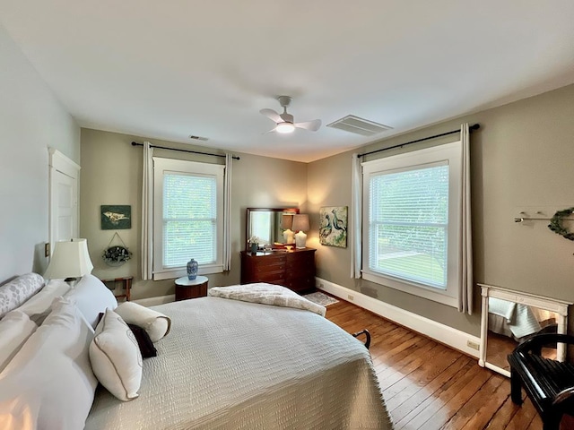 2453 Sand Hill Dr, Cape Charles, VA 23310 - bedroom featuring wood-type flooring, baseboards, and ceiling fan