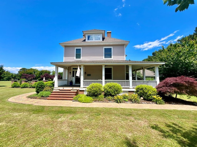 2453 Sand Hill Dr, Cape Charles, VA 23310 - view of front facade with a chimney, a front lawn, and a porch