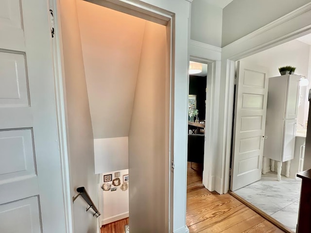 2453 Sand Hill Dr, Cape Charles, VA 23310 - hall with light wood-style floors and an upstairs landing